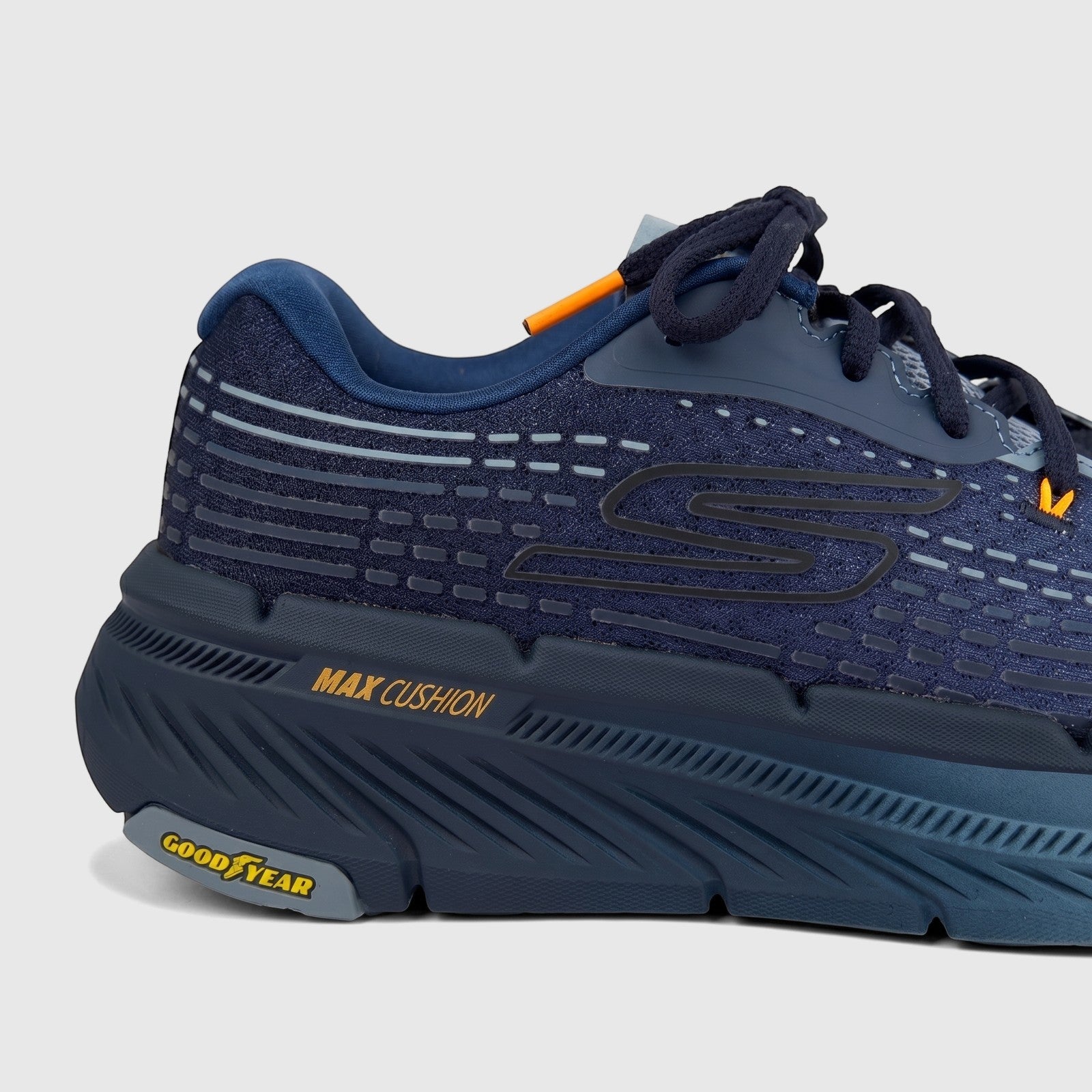 Close-up of a navy blue Skechers Men's Comfort Sneaker Max Cushioning Premier 2.0 running shoe, side view.