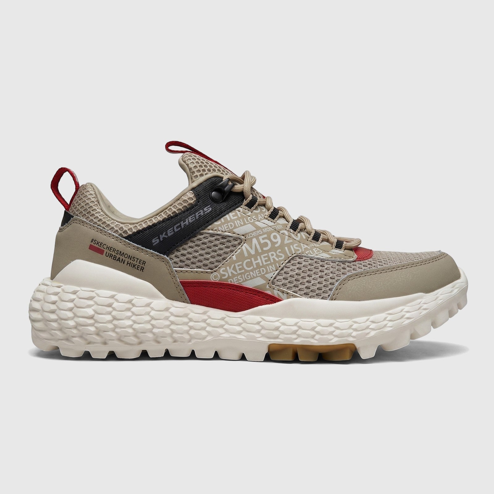 Skechers Men's Comfort Sneaker Monster Mashton in taupe multi with mesh upper, red accents, and chunky white sole, side view.