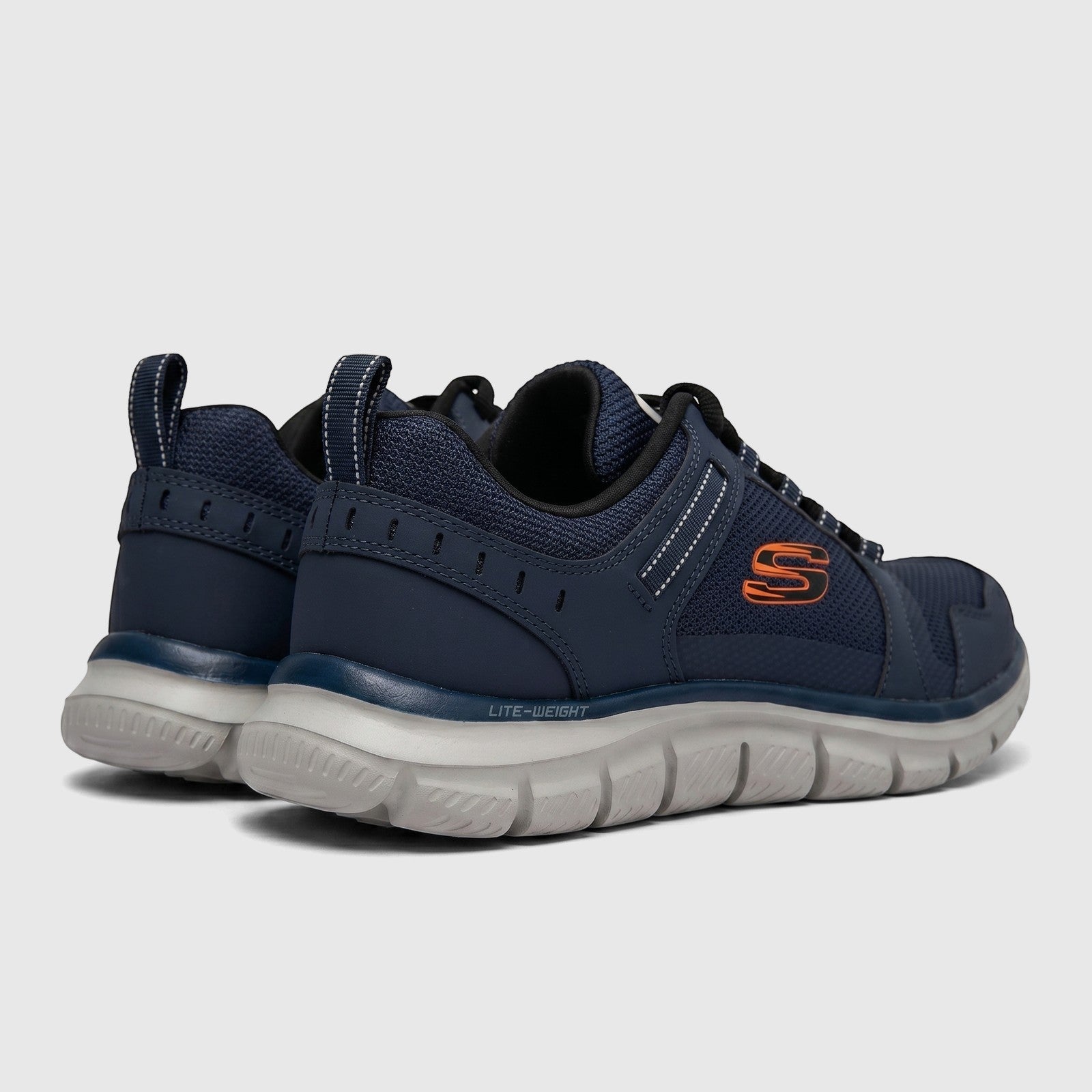 Skechers Men's Comfort Sneaker Track 232001 in navy and orange, shown from a rear-side view displaying Lite-Weight midsole.