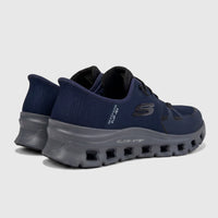 Skechers Men's Glide-Step Pro comfort sneakers in navy and charcoal, rear quarter view, on a studio backdrop.