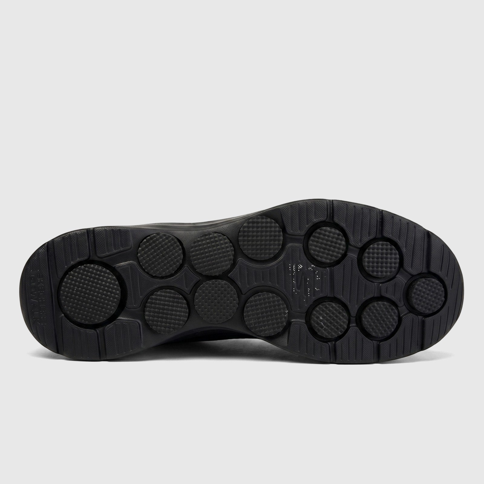 Skechers Men's Go Walk 7 216636 black comfort sneaker, showcasing the full textured sole from a bottom view.