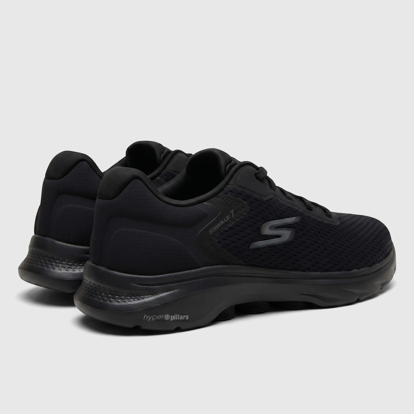 Black Skechers Men's Go Walk 7 comfort sneakers from a rear-side view, featuring Hyper Pillars technology.