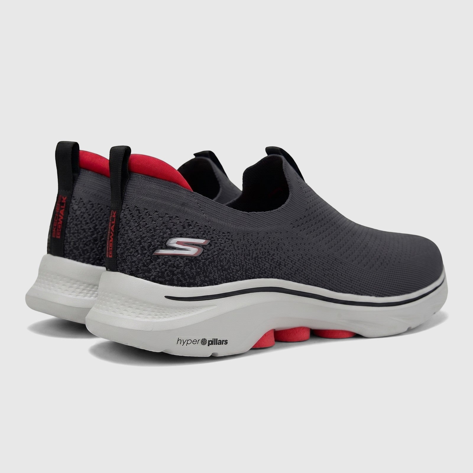 Skechers Men's Go Walk 7 slip-on sneakers in charcoal black with red accents, shown from a rear-quarter view.