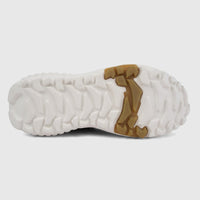 Underside view of Skechers Men's Monster Mashton comfort sneaker sole, featuring rugged white and tan multi-directional