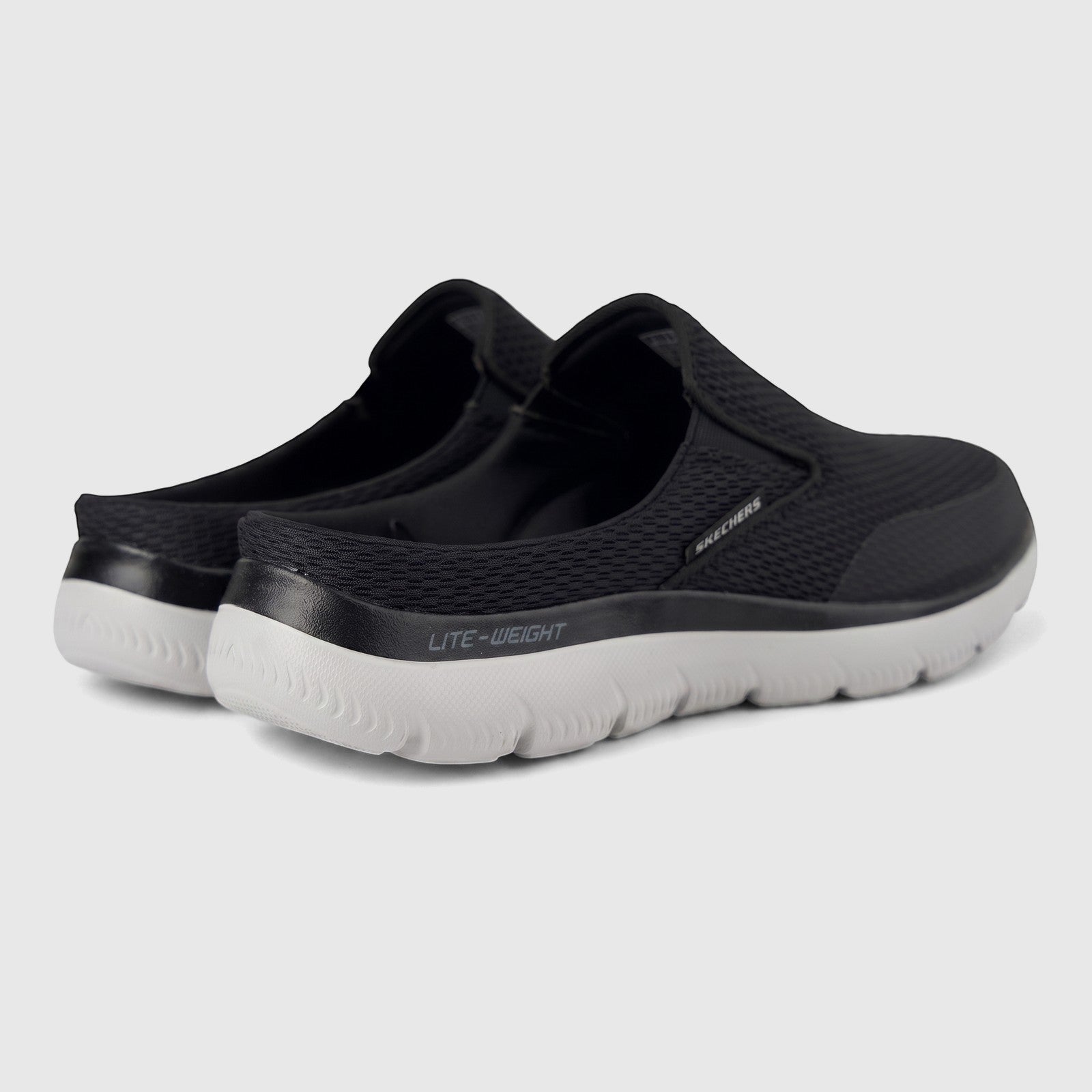 Angled view of black Skechers Men's Summits Vindicator slip-on shoes with mesh upper and grey lightweight sole.