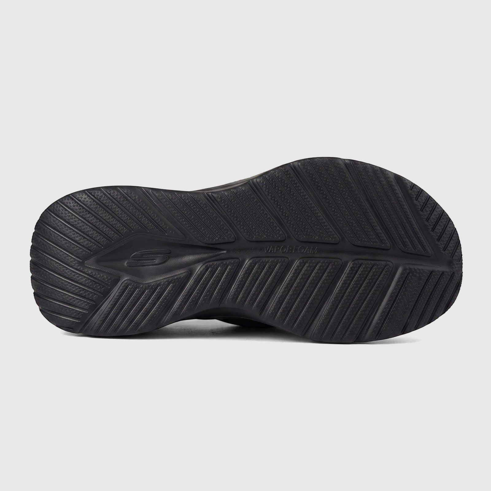 Close-up view of the black Skechers Mens Vapor Foam Slide Sandal sole, featuring detailed tread and branding.