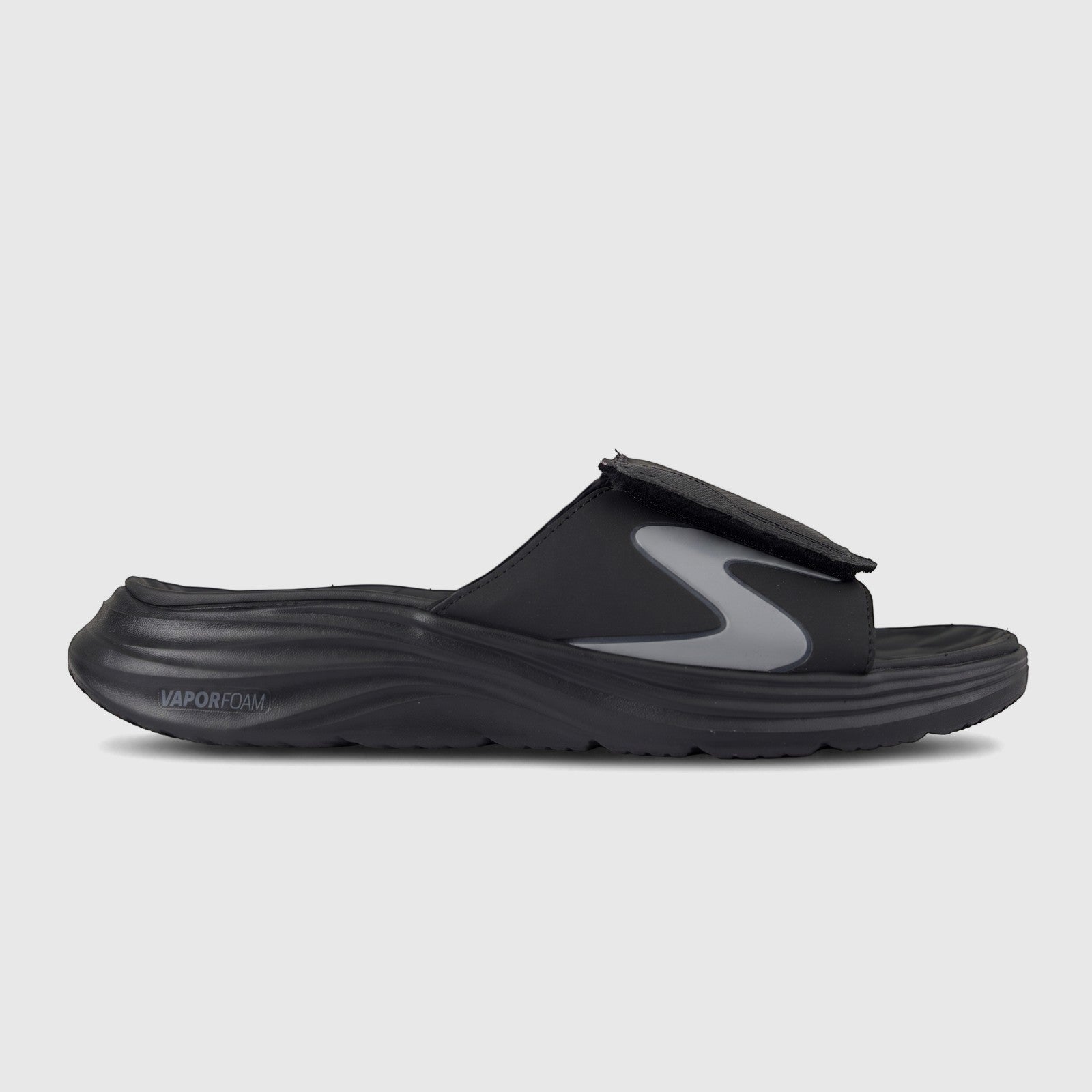 Skechers Men's Vapor Foam slide sandal in black, featuring a contoured footbed and an adjustable hook-and-loop strap with a