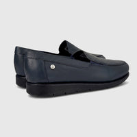 Thea Comfort Shoe Navy 01358 slip-on loafers in navy leather, side view showing low wedge sole and stitched upper.