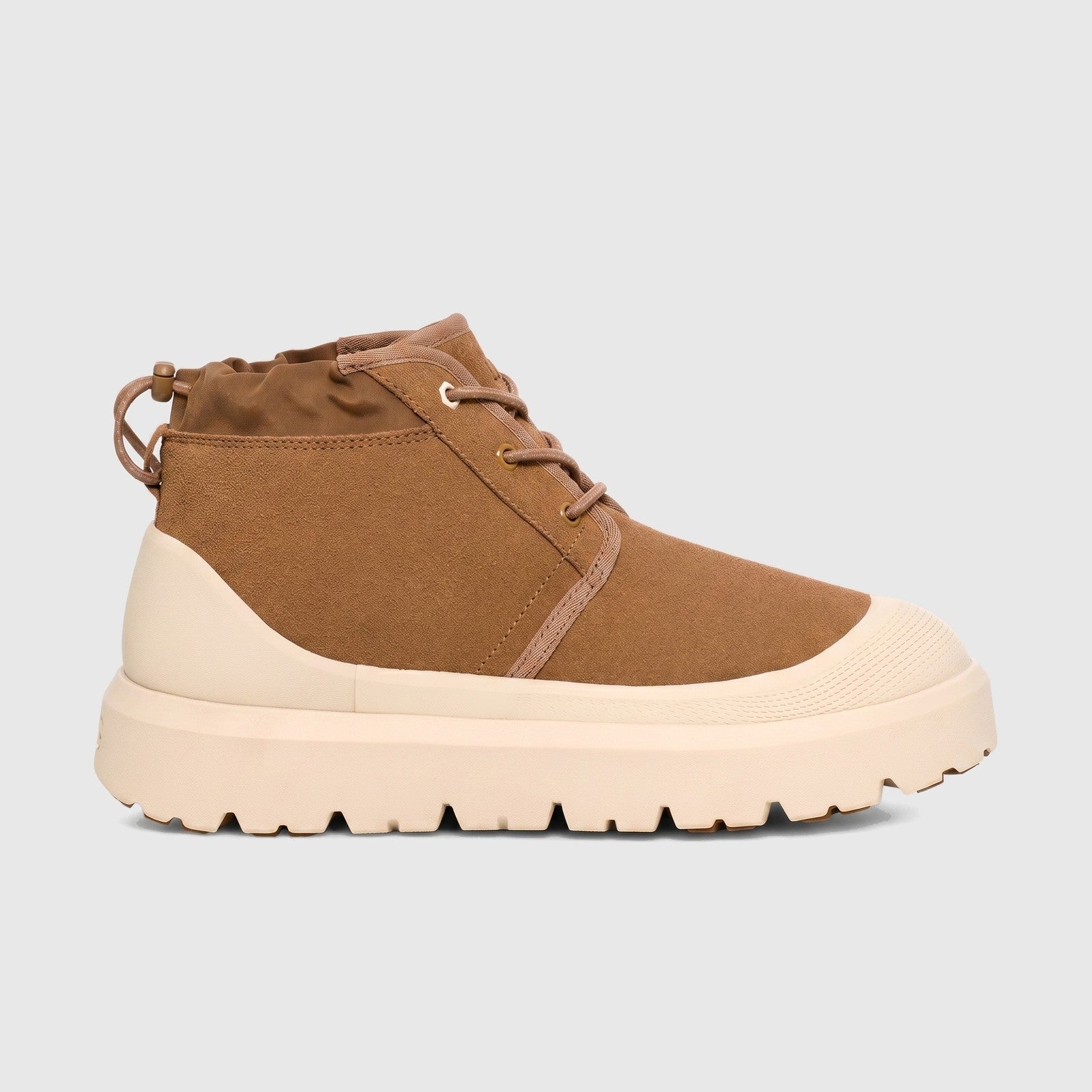 Ugg Neumel Weather Hybrid ladies boot in chestnut suede with white cap toe and chunky lug sole, side view.