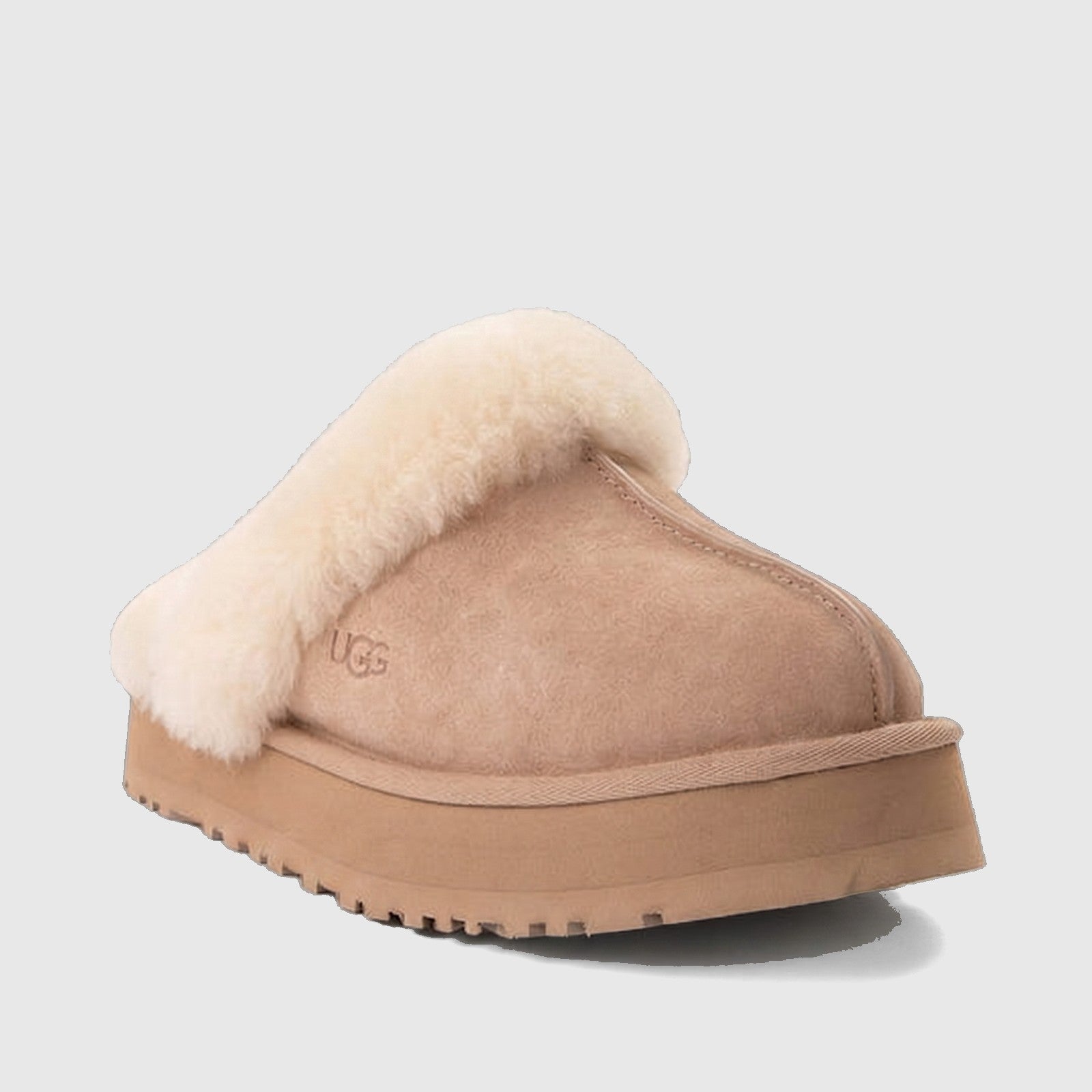 Ugg Ladies Disquette clog 1122550 in sand suede with plush shearling collar, side view slip-on platform sole