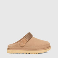 Ugg Ladies Goldenstar Clog Sand 1138252 slip-on suede clog in sand color with adjustable strap, side view