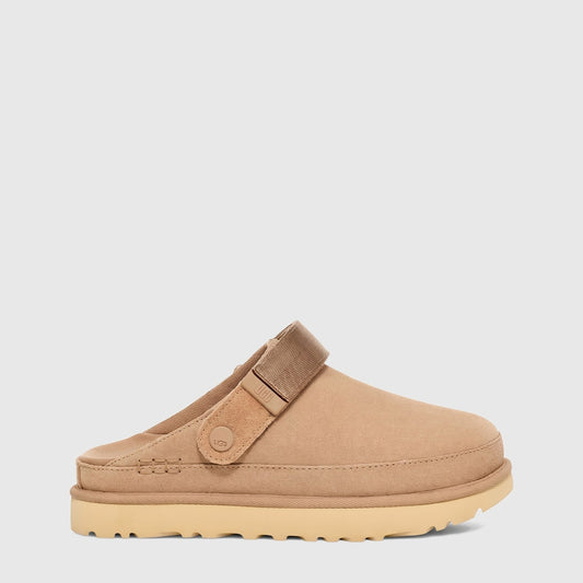 Ugg Ladies Goldenstar Clog Sand 1138252 slip-on suede clog in sand color with adjustable strap, side view