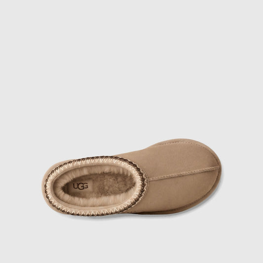 Ugg Ladies Clog Tasman II Moonlight slip-on clog in light beige suede with braided collar trim, side view