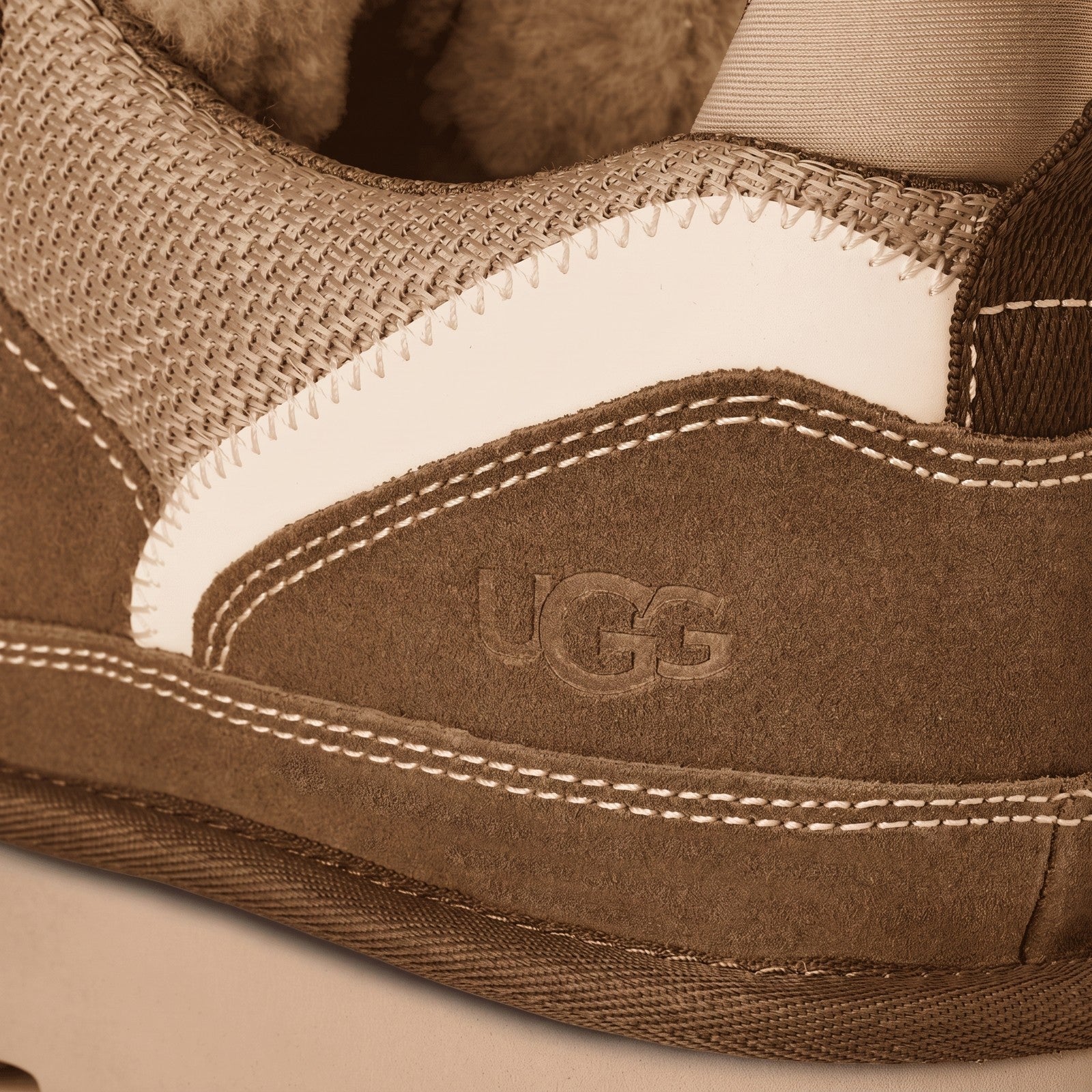 Ugg Ladies Sneaker Lowmel 1144032 Light Bronze, close-up side view of suede and mesh upper with UGG logo.