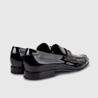 Valentino men's black patent leather dress slip-on shoes. View highlights the glossy finish and classic loafer design.